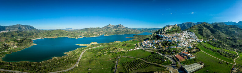 Zahara de la Sierra aerial view of medieval castle, hilltop village and lake near Sevilla Spain