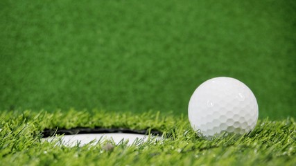 Wall Mural - Golf ball near the hole or pin