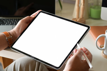 Business man using digital tablet on workspace
