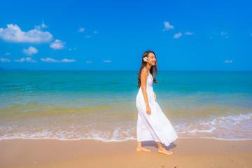 Wall Mural - Portrait beautiful young asian woman happy smile leisure on the beach sea and ocean