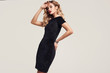 Gorgeous elegant sensual blonde woman wearing fashion black dress