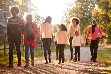 Wall Mural - Multi Generation Family On Autumn Walk In Countryside Together