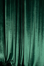 Green Curtain Of Luxurious Velvet On The Theater Stage. Copy Space. The Concept Of Music And Theatrical Art.