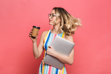 Canvas Print - Cheerful young woman wearing eyeglasses standing