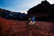 © Cavan Images - A middle age man celebrates the new year by riding the aptly named Hangover Trail through the red rock country surrounding Sedona, AZ at sunset.