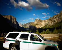 Park Ranger Vehicle With Yosemite Valley In The Background.