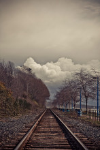 Railway Tracks Run Along White Rock Beach In British Columbia Canada As A Storm Approaches.