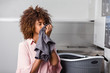 © Samuel B. - Young black African American woman washing her clothes in a automatic laundry
