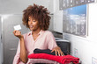 © Samuel B. - Young black African American woman holding a laundry subscription card
