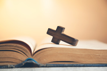 wooden cross on the  book