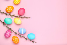 Colorful Easter Eggs With Willow Branches On Pink Background