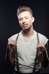 Wall Mural - Young man dressed in rock'n'roll or rockabilly style.