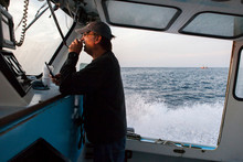A Fisherman Heads Out On His Boat