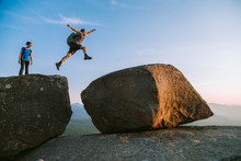 Man Jumping Across Boulders, Pitchoff?Mountain, Adirondack Mountains, New York State, USA