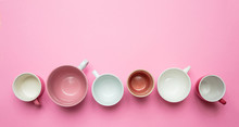 Empty Coffee Cups White And Pink Color Against Pink Background, Top View