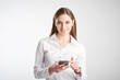 © sepy - Young professional woman text messaging