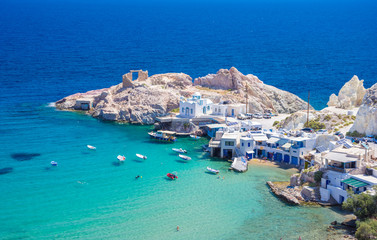 Wall Mural - Scenic Firopotamos village (traditional Greek village by the sea, the Cycladic-style) with sirmata - traditional fishermen's houses, Milos island, Cyclades, Greece.