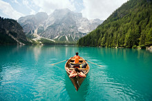 Couple In Row Boat On Azure Lago Di Braies, Italy
