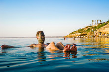 Man Floating In Dead Sea, Madaba Governorate, Jordan