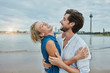 © Westend61 - Germany, Duesseldorf, happy young couple at Rhine riverbank