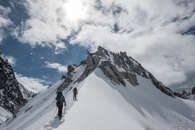 A Rope Team Climbs A Ridge On The Munchkin In Little Switzerland In Denali National Park. 