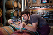 © Cavan Images - Winemaker working in winery
