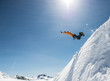 © Cavan Images - A man jumps of a snowbank in the Mount Baker Backcountry.