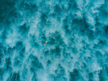 Aerial View Of Woman Paddling On Longboard Surfboard In Sea, Tenerife, Canary Islands, Spain