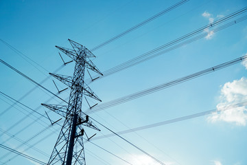 High voltage post. High voltage tower sky background.