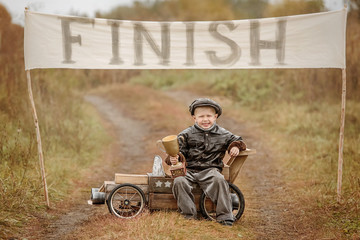 Wall Mural - Portrait of a boy-racer with the cup from his car