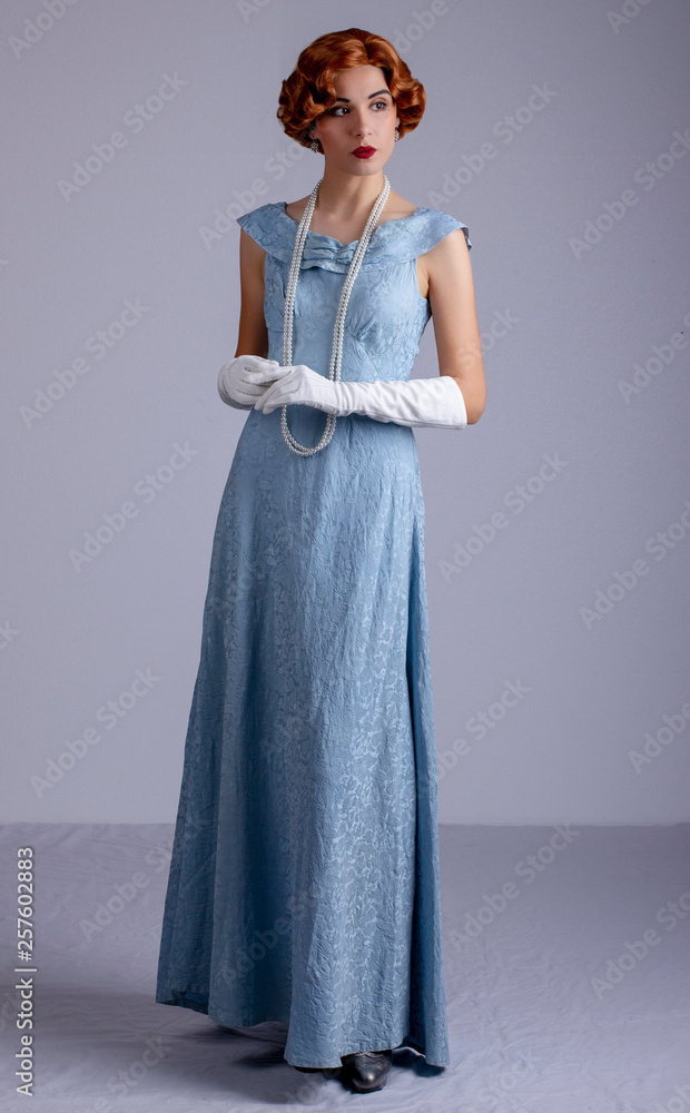 Glamorous 1930s woman in blue dress Stock Photo | Adobe Stock