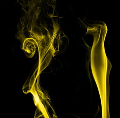 Yellow smoke on black background