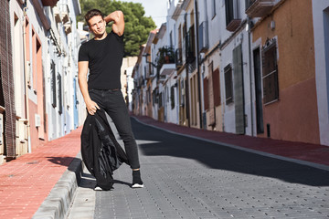 Wall Mural - Handsome young man in black