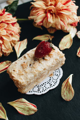 Wall Mural - Piece of delicious fresh Napoleon cake with crumbs and strawberry