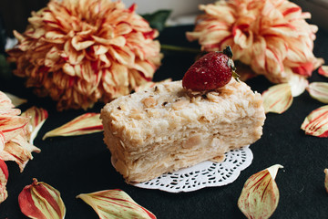 Wall Mural - Piece of delicious fresh Napoleon cake with crumbs and strawberry