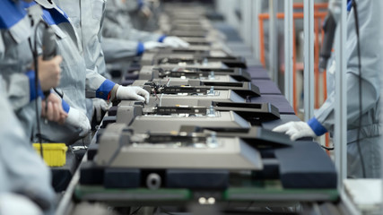Line Assembly of TVs. Selective focus in the center