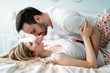 © NDABCREATIVITY - Portrait of young loving couple in bedroom