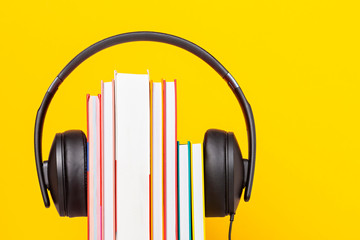 Group of books with the earphones. Audiobooks concept