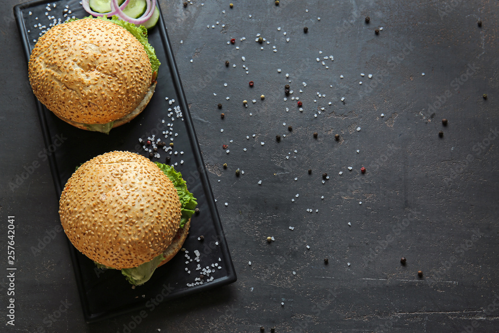 Tasty fresh burgers on table