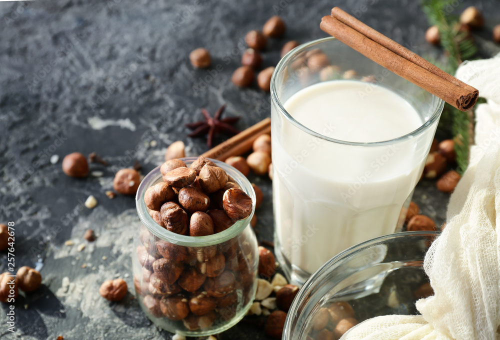Composition with healthy hazelnut milk on table