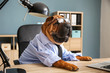 Cute funny dog dressed as businessman in office