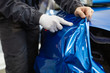 © hedgehog94 - Car wrapping specialist putting vinyl foil or film on car. Selective focus.