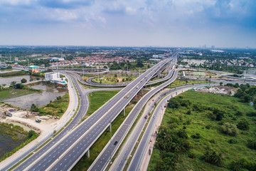 Wall Mural - City traffic road with modern building aerial view