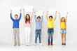 © master1305 - Group of happy surprised children with a white empty banners isolated in white studio background. Education and advertising concept