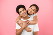 © Prostock-studio - Man giving piggyback ride to his girlfriend on pink background