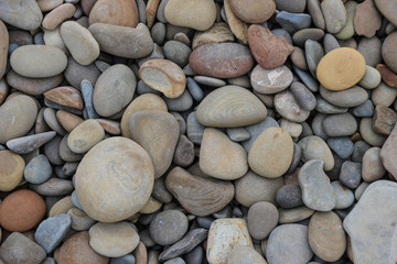 Colorful large pebbles on the beach closeup, Black sea