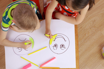 the development of emotional intelligence. child psychology. girl and boy depict different emotions.