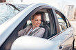 © bnenin - Beautiful woman driving a car.