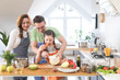 © yanlev - Family cooking in the kitchen at home