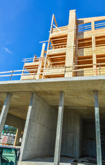 Wall Mural - Brand new low-rise building under construction on sunny day in British Columbia, Canada